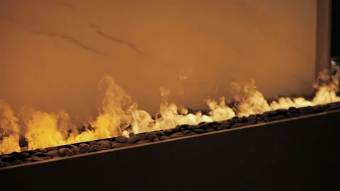 Close-up artificial electronic fireplace burning with smoke fire. Bio fireplace  Video stock 169937710