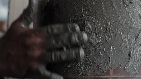Close Up of Artisan Applying Clay Paste over Wax Saint Medallion on Bell Mold 4K Video stock 340171273