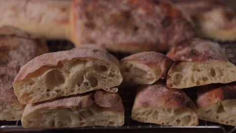 Close-up of artisan bread loaf showing crust and crumb texture Stock Footage 331207870