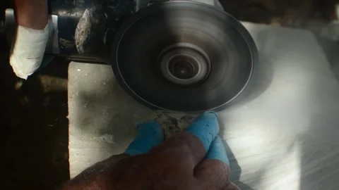 Close-Up of Artisan Cutting Seashell with fingers protected by latex and tape Stock Footage 340856997