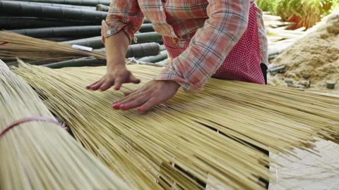 Close-up of artisan hands crafting bamboo products in slow motion 4K Stock Footage 330850307