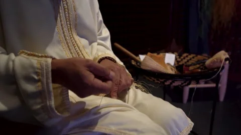 Close-Up of Artisan Hands Weaving Traditional Handmade Shoes Stock-Footage 337036478