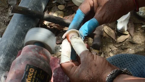 Close Up of Artisan Polishing Seashell with Rotary Buffing Wheel in Traditional Stock Footage 339120888