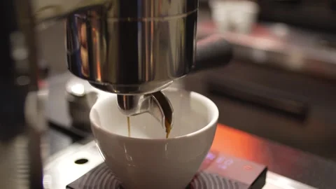 Close-up of artisanal espresso preparation, white cup in modern specialty Stock Footage 336531052