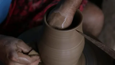 Close-up of Artisan's Hands Shaping Clay Vase on Pottery Wheel, Top-Down Stock Footage 321905163