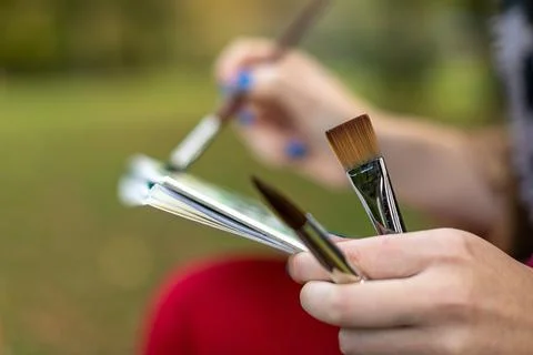 Close up of artist painting outdoors Stock Photos