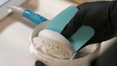 Close up of an artist using plaster and mix to create a art creation. Creat.. Stock Footage 238937210