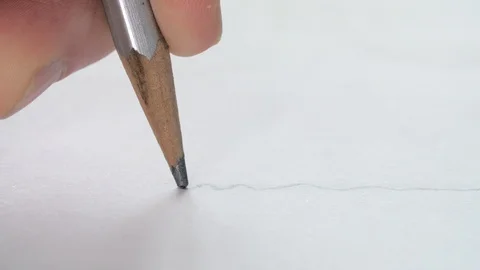 Close-up of artists drawing a wavy line with a wooden pencil on paper. Stock Footage 104377725
