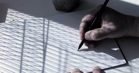 Close-up of artist's hands doing sketch with pencil Stock Footage 128914690