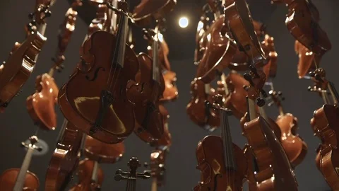 Close up artwork of hanging violins Stock Footage 82076779