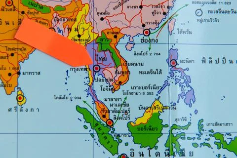 Close up of Asia map with red arrow marking Thailand top Stock Photos