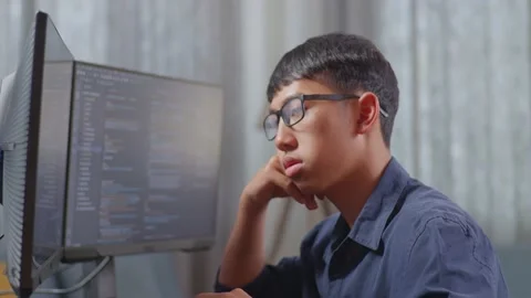 Close Up Of Asian Boy Programmer Being Bored Creating Software Engineer Stock Footage 233463885