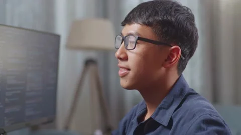 Close Up Of Asian Boy Programmer Creating Innovative Software Engineer Stock Footage 233463062