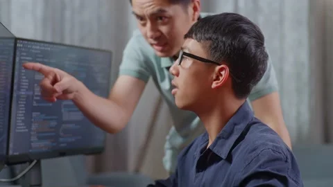 Close Up Of Asian Boy Students Studying Software Code From Male Teacher Or Stock Footage 233464307