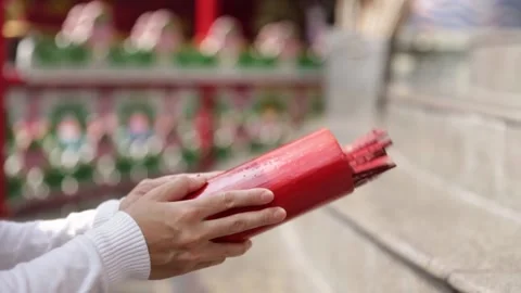 Close up asian buddhist hand predicting fortune by shaking chi chi stick Stock Footage 147134045