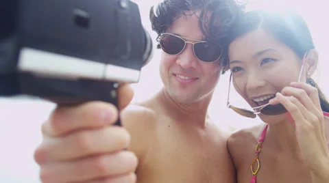 Close Up Asian Chinese Young Couple Smiling Filming Selfie Stock Footage