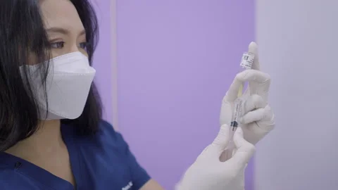 Close up of asian doctor extracting solution for face rejuvenation therapy - Video stock 205889320