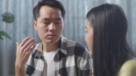 Close Up Of Asian Father Explaining Something To His Daughter While Sitting Stock Footage 233440189
