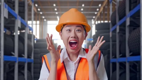 Close Up Of Asian Female Engineer Smiling To Camera Saying Wow Tire Warehouse Stock Footage 341788426