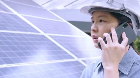 Close up, Asian female engineer working outdoors, making telephone call, talking Stock Footage 156689112