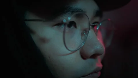 Close up of asian hacker looking on screen of computers Stock Footage 257382121