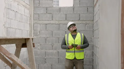 Close-up, Asian male construction engineer, wearing full clothing, safety  . Stock Footage 264034426