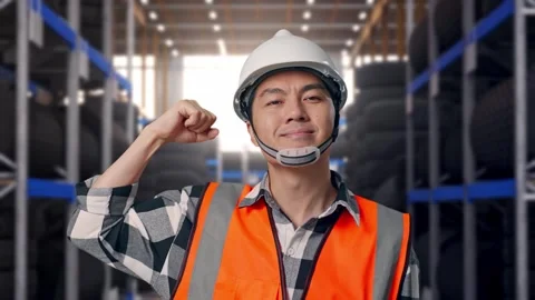 Close Up Of Asian Male Engineer Flexing His Bicep And Smiling To Camera Tire Stock Footage 341787088