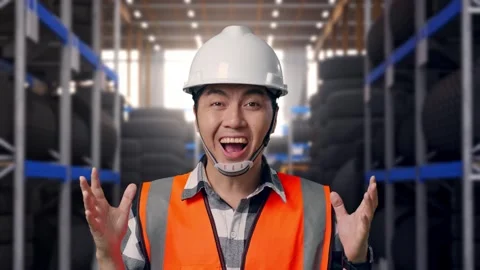 Close Up Of Asian Male Engineer Smiling To Camera And Saying Wow Tire Warehouse Stock Footage 341786861