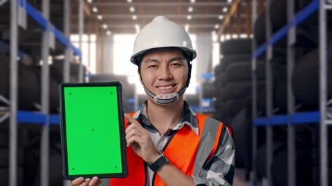 Close Up Of Asian Male Engineer Smiling And Showing Green Screen Tablet Tire Stock Footage 341786872
