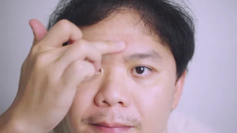 Close-up of Asian Man Checking Skin Aging and Acne in Bathroom Mirror. Stock Footage 337769222