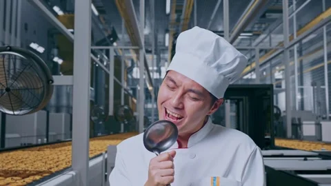 Close Up Of Asian Man Chef Holding Ladle And Singing In Cookie Factory Stock Footage 318081759