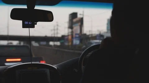 Close up of Asian man driving through traffic congestion in Bangkok, Thailand Stock Footage 107479937