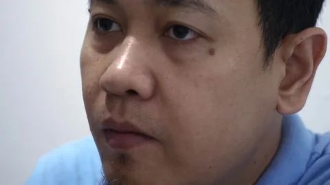 Close up of Asian man eating grape fruit Stock Footage 290906541