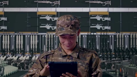 Close Up Of Asian Man Soldier Using A Tablet In Military Armory Stock Footage 313740224