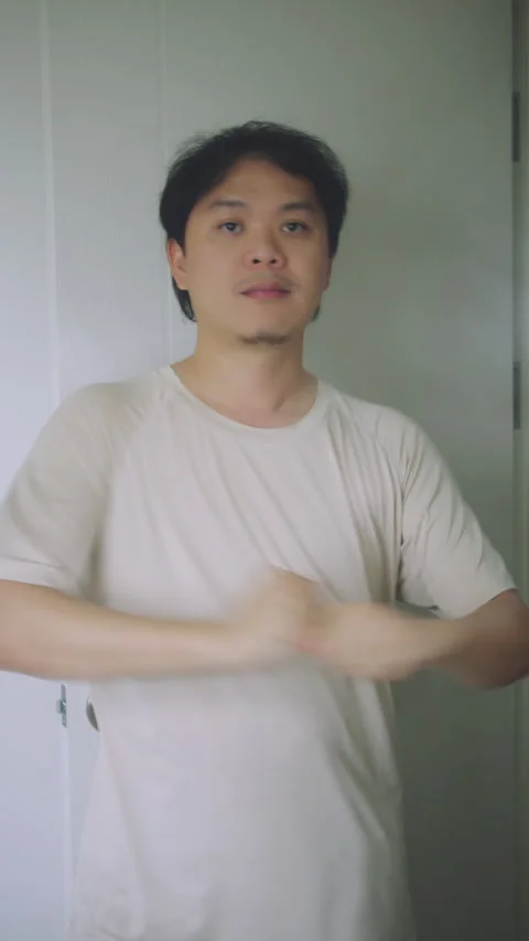 Close-up of Asian Man Stretching Body in Bathroom. Healthy Morning Routine Stock Footage 337769559