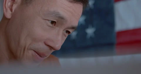 Close up of an Asian man voting at a polling station Stock Footage 274916787