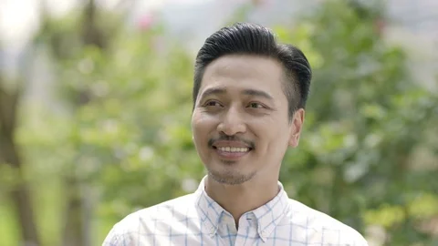 Close up of Asian man waving hands, smiling goodbye Video stock 78200826