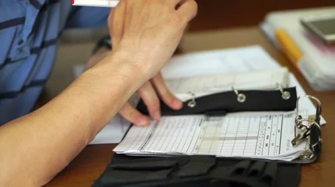 Close up Asian man working. Guy thinking and writing in his notebook Stock Footage 63129305