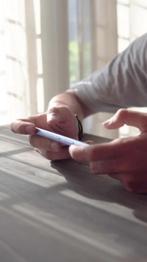Close up of Asian man's hand playing video game with smartphone Stock Footage 317919873