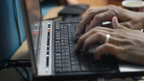 Close up of a Asian Man's hand Typing on a Laptop Keyboard 動画素材 161140452