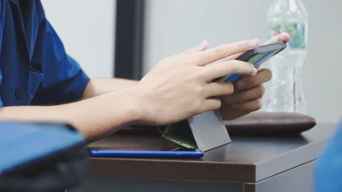 Close up of asian students hand touching the screen of a tablet pc Video stock 107613982