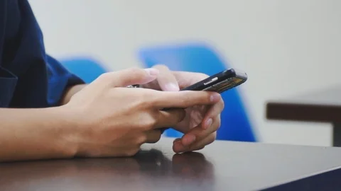Close up of asian students hand using smartphone in class which distracted them Stock-Footage 107613685