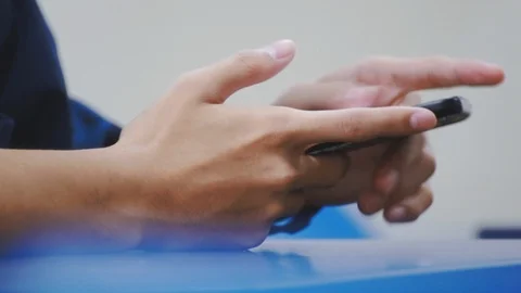 Close up of asian students hand using smartphone in class which distracted them Stock Footage 107613709