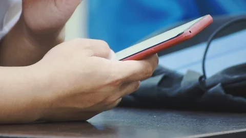Close up of asian students hand using smartphone in class which distracted them Stock Footage 107613824