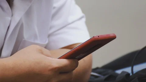 Close up of asian students hand using smartphone in class which distracted them Stock Footage 107613885