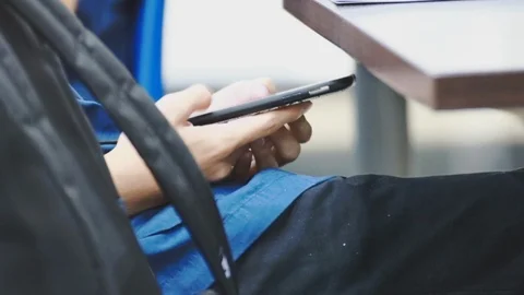 Close up of asian students hand using smartphone under the desk during class 스톡 동영상 107613920