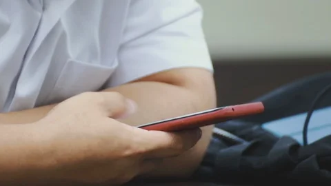 Close up of asian students hand using smartphone in class Stock-Footage 107614071