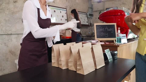 Close up Asian Waitress Preparing take away food while customer choose order Stock Footage 144390456