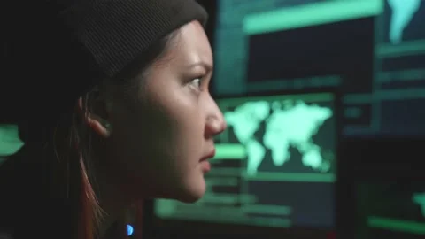 Close Up Asian Woman Hacker Using Computer Hacking, Code On Multiple Computer Stock Footage 161458217