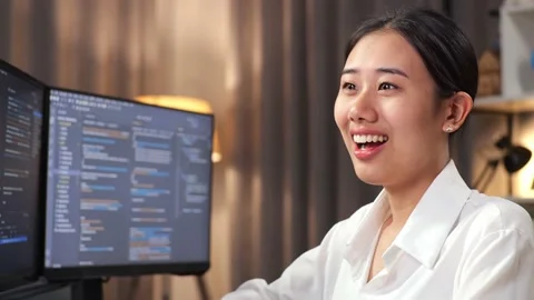 Close Up Of Asian Woman Programmer Smiling To Camera While Creating Software Stock Footage 232034963